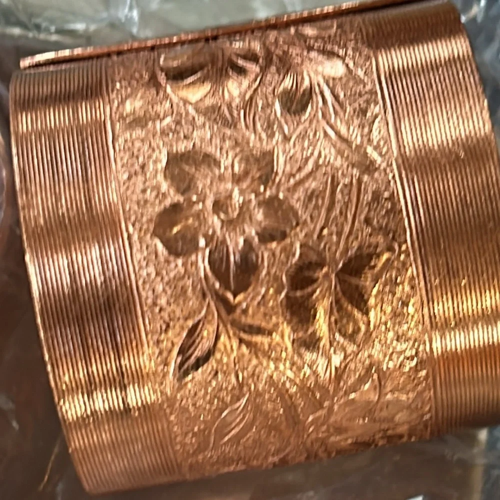 Vintage Coppercraft set of 4 copper napkin rings in box.